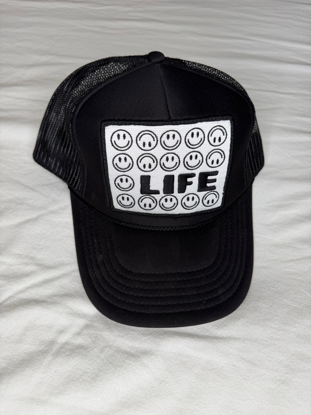 Black Trucker Hat with 'LIFE' Smiley Patch
